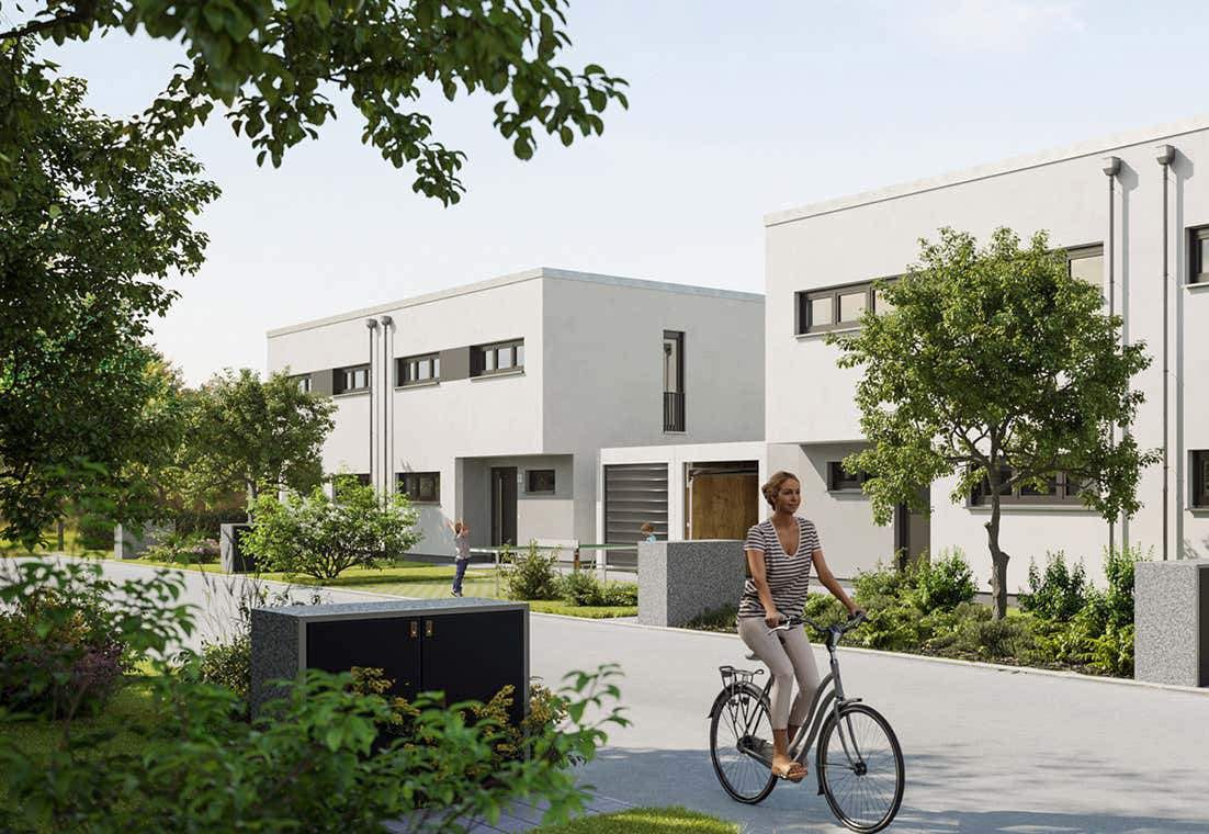 Außenansicht eines Neubauprojekts von Bonava in Sachsen mit moderner weißer Fassade, Gärten und ruhiger Wohnstraße.