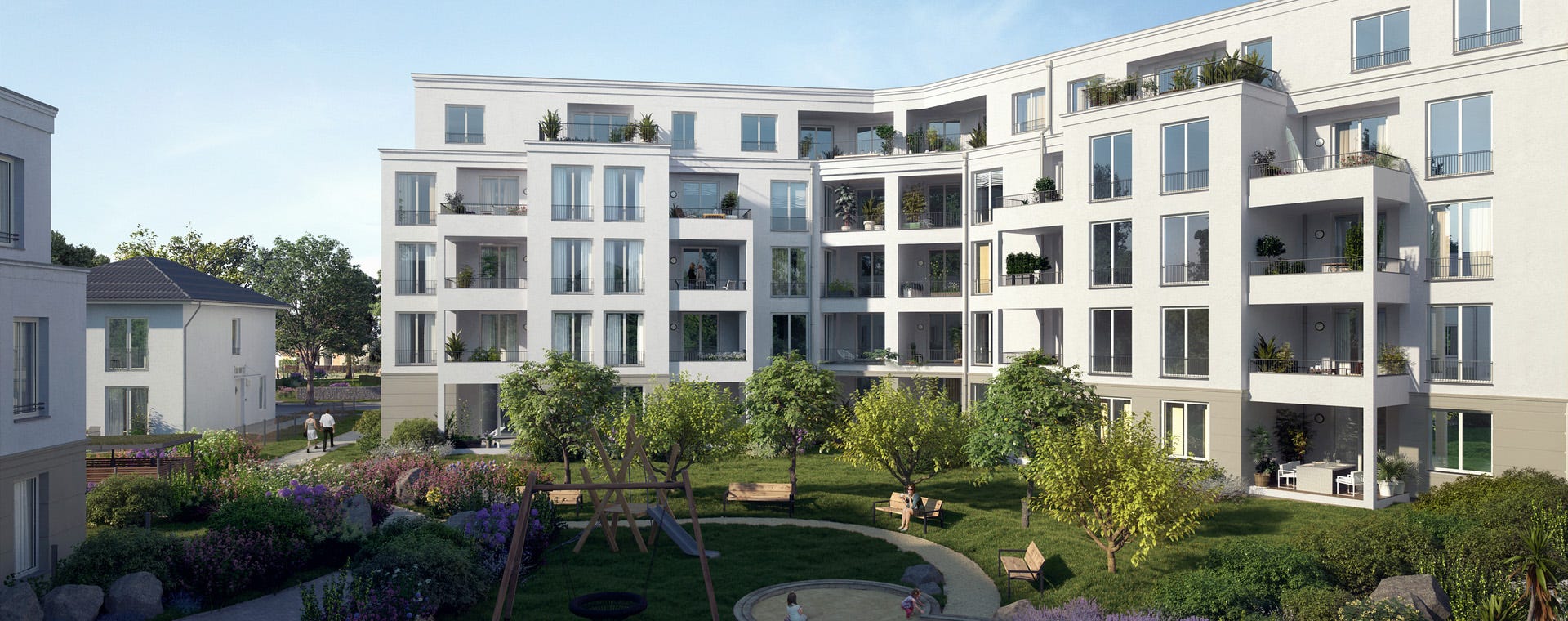 Innenhof eines Neubauprojektes von Bonava in Berlin mit Bäumen, Bänken und Spielplatz